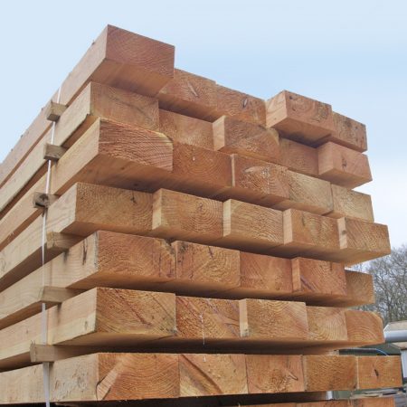 Oak sleepers beams piled up ready for delivery