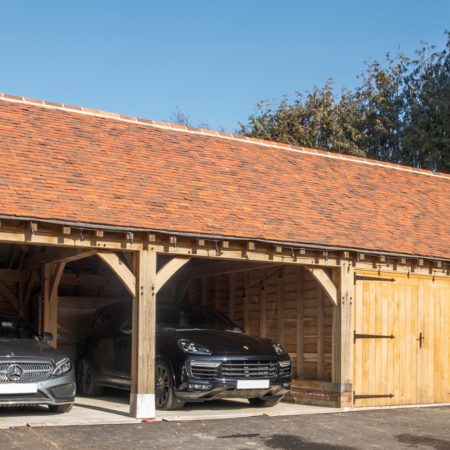 Green oak cartshed garage produced in Kent